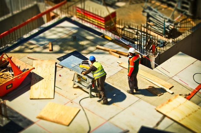 2-man-on-construction-site-during-daytime